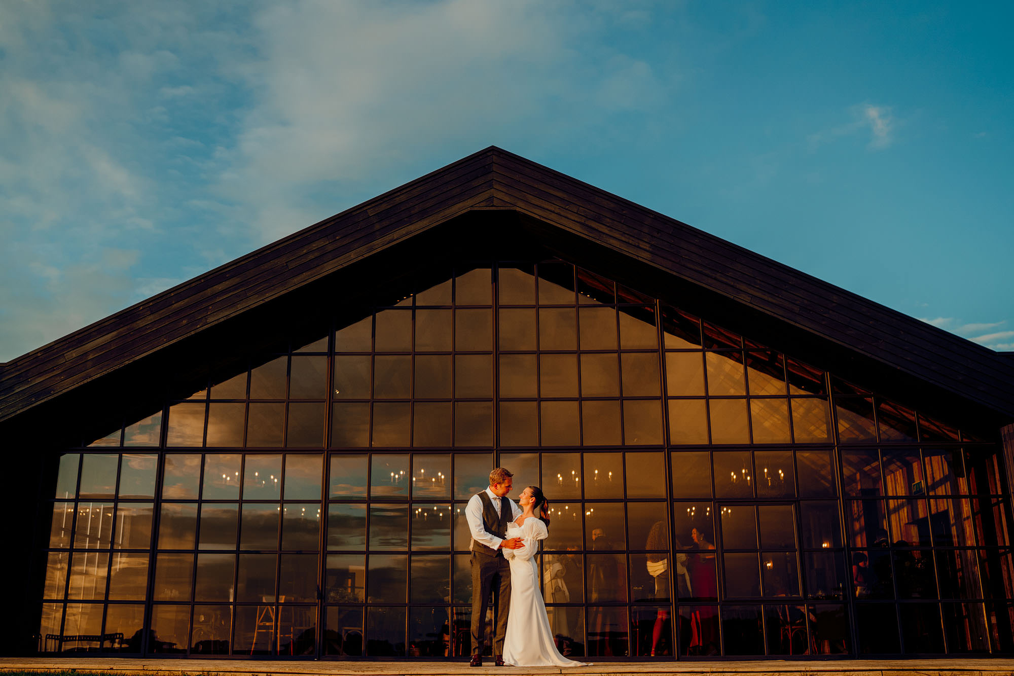 sunsets Barn at Botley Hill Colourful Wedding Photography by Hamish Irvine 